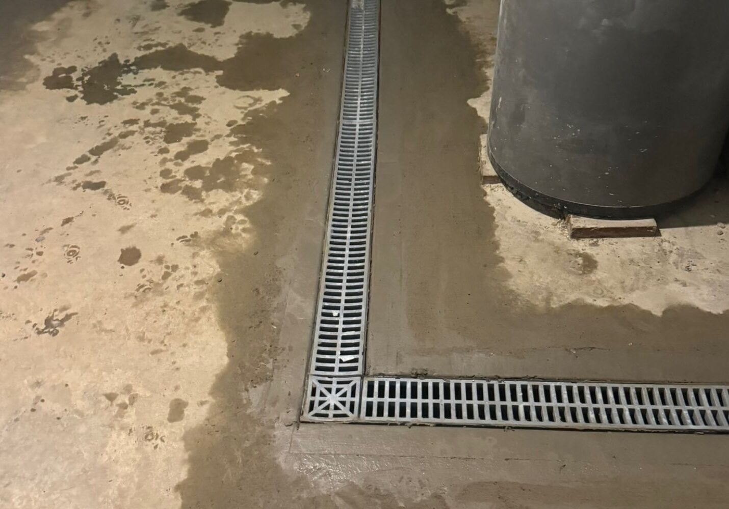 Basement floor with a drainage system installed.